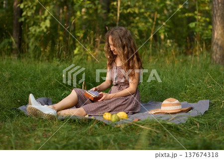 forest reading session woman absorbed in book forest reading session woman absorbed in book 137674318