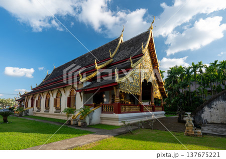 Wat Chiang Man in Chiang Mai Thailand at sunset with its iconic elephant encircled golden stupa and historic Lanna architecture, a must see cultural and travel destination. 137675221