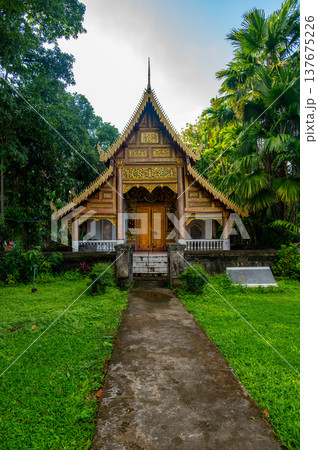 Wat Chiang Man in Chiang Mai Thailand at sunset with its iconic elephant encircled golden stupa and historic Lanna architecture, a must see cultural and travel destination. 137675226