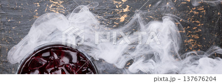 Smoky red cocktail banner with ice Smoky red cocktail banner with ice 137676204