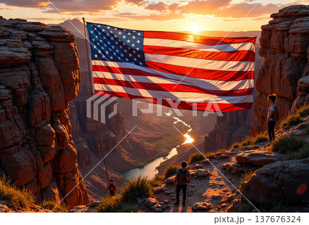 Hikers view american flag over grand canyon 137676324