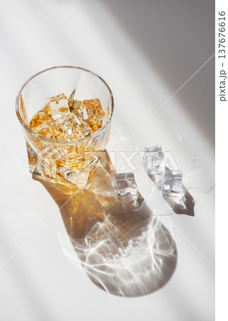 Whiskey Glass with Ice. Sophisticated Bar Ambience Whiskey Glass with Ice. Sophisticated Bar Ambience 137676616