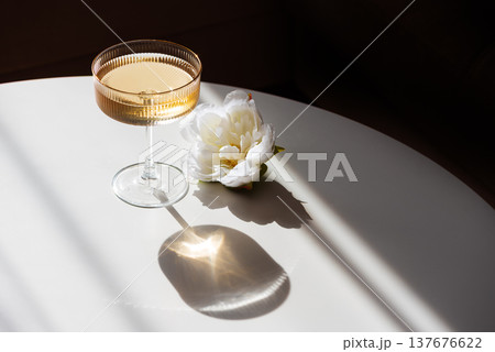 Champagne Glass with Golden Sparkle. Festive Celebration 137676622