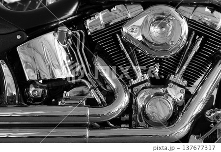Shiny chromium plated v-shaped engine stock photo. Chromium plated v type motorbike engine close up view Shiny chromium plated v-shaped engine stock photo. Chromium plated v type motorbike engine close up view 137677317