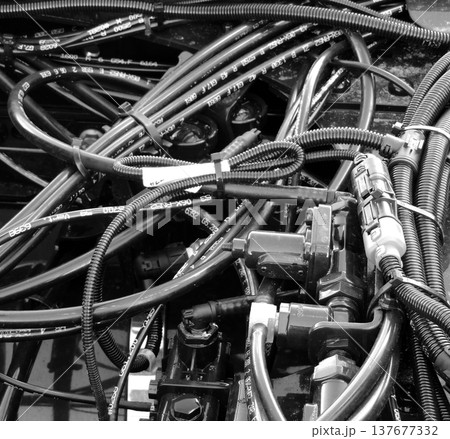 Engine wiring with bundles of isolation tubes, coolant hoses and corrugated pipes Engine wiring with bundles of isolation tubes, coolant hoses and corrugated pipes 137677332