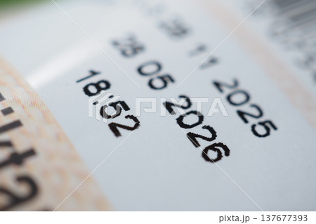 closeup of expire date on a food packet  137677393