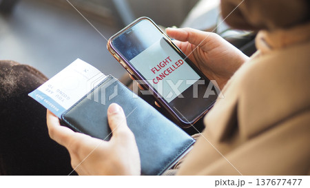 Flight cancellation notice shown on a smartphone screen 137677477