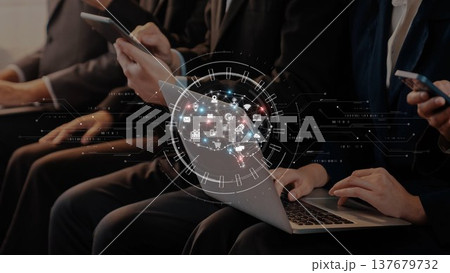 Modern Business Professionals Engaged with Technology in a Conference Setting, Using Laptops and Smartphones to Connect and Collaborate. Raster 137679732