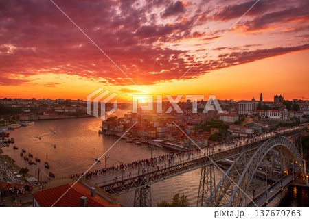 Scenic view of Porto city during sunset with a bridge over the river in Portugal. 137679763