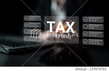 Tax Refund Concept with Laptop and Hand Showing Digital Interface for Financial Management and Tax Preparation Process in a Dark Environment Gantry 137679781