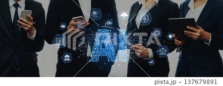 Business team using technology and communication devices with artificial intelligence graphics and modern digital elements for corporate innovation Trope 137679891