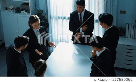 Top view of business team pointing at table while brainstorm idea. Directorate. Top view of business team pointing at table while brainstorm idea. Directorate. 137680066