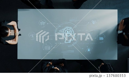 Business meeting discussing artificial intelligence concepts with digital projection on conference table for innovation and strategy planning. Raster 137680353
