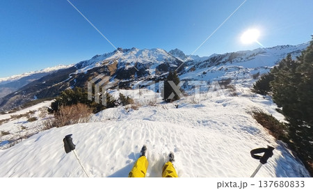 Alpine Skier POV Resting on Snowy Mountain Ridge with Panoramic View 137680833