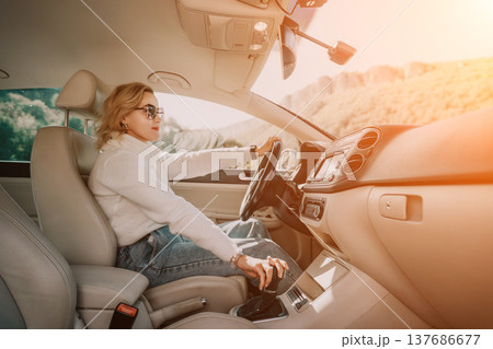 Woman Driving Car Mountain Road Trip 137686677