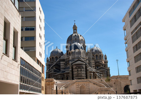 Domes and towers of the Marseille Cathedral of Sainte-Marie-Majeure in the La Joliette district, neo-Byzantine architecture under a blue sky 137687875