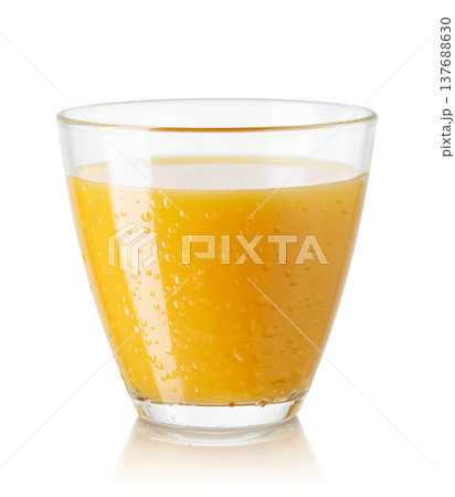 Glass of freshly squeezed cold orange juice isolated on white background 137688630