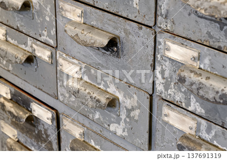 Very old grey metal cabinet with multiple drawers - cards, files, tools or fasteners storage unit Very old grey metal cabinet with multiple drawers - cards, files, tools or fasteners storage unit 137691319