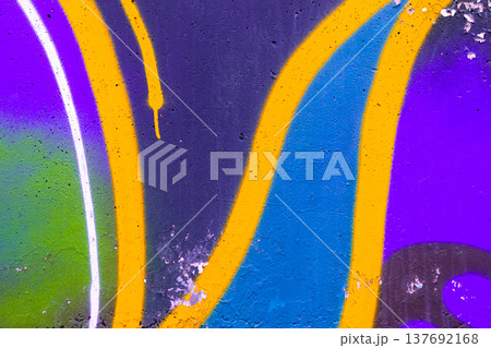 Vibrant graffiti wall with abstract shapes in purple, blue, yellow, urban art context 137692168