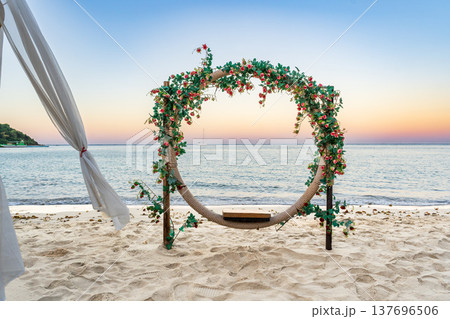Romantic Beachfront Floral Installation at Sunset 137696506