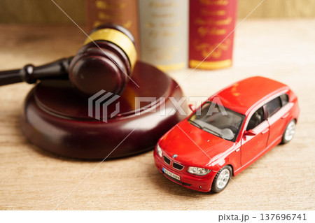 Bangkok, Thailand March 15, 2023 Car accident lawsuit and insurance, Judge hammer with car model. Bangkok, Thailand March 15, 2023 Car accident lawsuit and insurance, Judge hammer with car model. 137696741