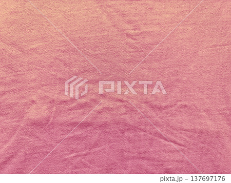 soft pink ribbed fabric texture unfolds in gentle wrinkles with gradient fade and ample copy space for minimalist wallpaper or commercial banner background soft pink ribbed fabric texture unfolds in gentle wrinkles with gradient fade and ample copy space for minimalist wallpaper or commercial banner background 137697176