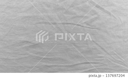 soft light gray knit fabric texture closeup with gentle wrinkles and ribbed weave evoking calm minimalism perfect for subtle wallpaper or copy space banner in web design soft light gray knit fabric texture closeup with gentle wrinkles and ribbed weave evoking calm minimalism perfect for subtle wallpaper or copy space banner in web design 137697204