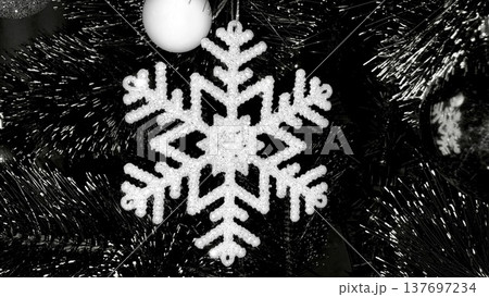 elegant monochrome sparkling snowflake christmas ornament closeup for holiday branding elegant monochrome sparkling snowflake christmas ornament closeup for holiday branding 137697234