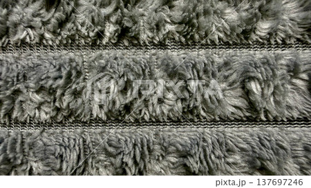 detailed close-up of gray shaggy carpet fibers with woven backing for graphic design detailed close-up of gray shaggy carpet fibers with woven backing for graphic design 137697246