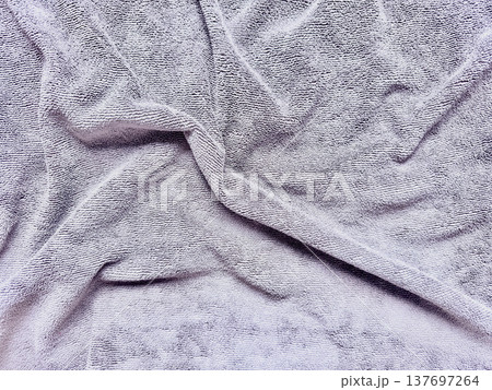 folded gray terrycloth towel texture for spa branding and web background 137697264