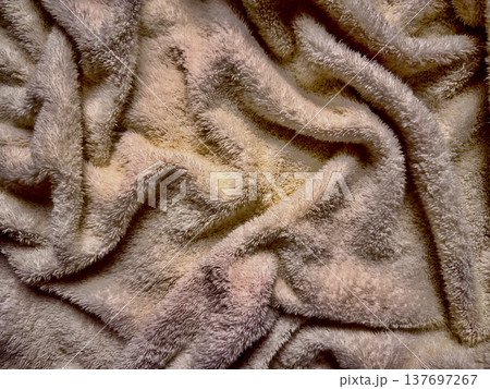 soft beige fluffy towel texture close-up with wavy folds for web design background 137697267