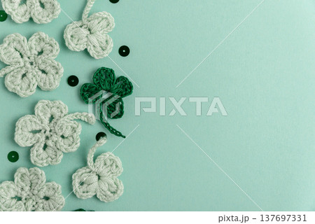Crocheted Four Leaf Clovers with Sequins.  Saint Patricks Day Decorative Background 137697331