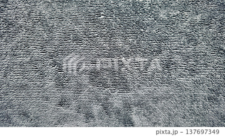 abstract gray microfiber towel fabric texture with soft looped pile and subtle shadows, neutral textile background for web design, print media, branding, packaging, and surface pattern use 137697349
