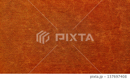 rich rust orange twill fabric texture closeup evoking warm autumnal coziness ideal for seamless wallpaper or design banner background 137697408