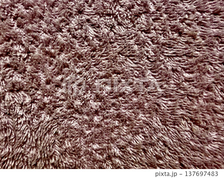 brown terrycloth texture macro view with fluffy looped fibers evoking warmth for cozy wallpaper or spa design backdrop 137697483