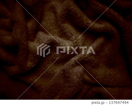 rich chocolate brown fleece texture undulates in soft folds evoking cozy warmth perfect for autumn wallpaper or inviting commercial backdrop 137697494