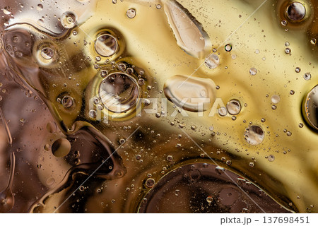 Abstract coffee brown liquid texture with oil bubbles macro background Abstract coffee brown liquid texture with oil bubbles macro background 137698451