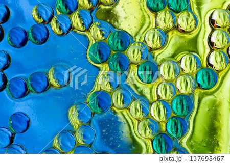 Artistic blue and yellow bubble mosaic in liquid macro fluid art Artistic blue and yellow bubble mosaic in liquid macro fluid art 137698467