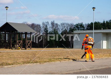 Landscaper using blower for park and rest area maintenance Landscaper using blower for park and rest area maintenance 137698483