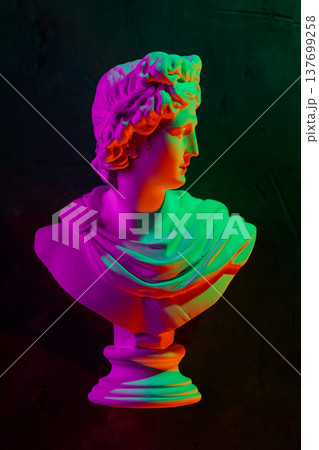 Colorful neon classical bust sculpture with vibrant gradient lighting on dark background Colorful neon classical bust sculpture with vibrant gradient lighting on dark background 137699258