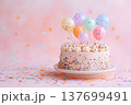 Birthday cake with colorful balloons and confetti poppers on pastel background, soft diffused light, editorial flat lay composition, cheerful festive mood 137699491