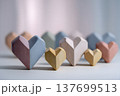 heart-shaped arrangement of geometric objects, shallow depth of field, soft pastel background, 137699513