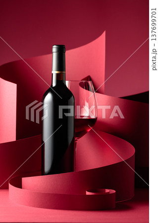 Bottle and glass of red wine. Bottle and glass of red wine. 137699701