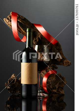Bottle with old empty label and glass of red wine. Bottle with old empty label and glass of red wine. 137699761