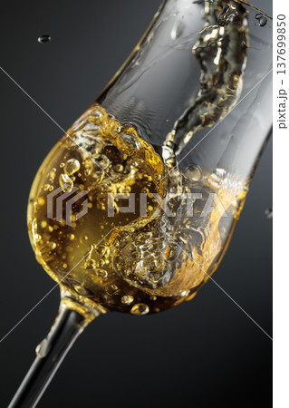 Whiskey is poured is poured into a glass. 137699850