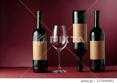 Red wine on a dark red background. 137699901