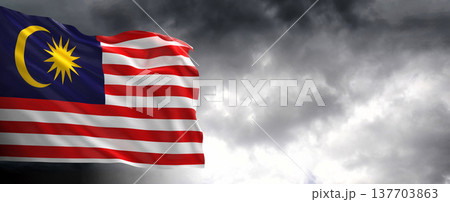 National flag of Malaysia with dark clouds, 3D rendering.	 137703863