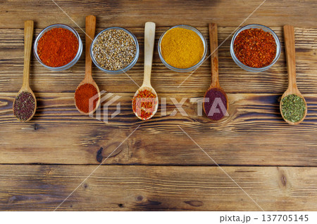 Set of different aromatic spices on wooden table. Top view, copy space Set of different aromatic spices on wooden table. Top view, copy space 137705145