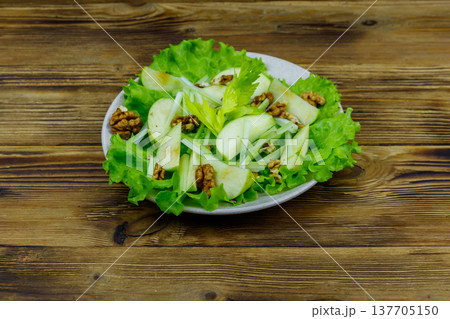 Waldorf salad on a wooden table Waldorf salad on a wooden table 137705150