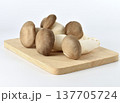 Group of organic mushrooms on wooden cutting board 137705724